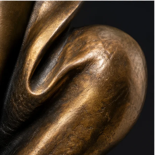 Dramatic bronze sculpture close-up for the final call to action
