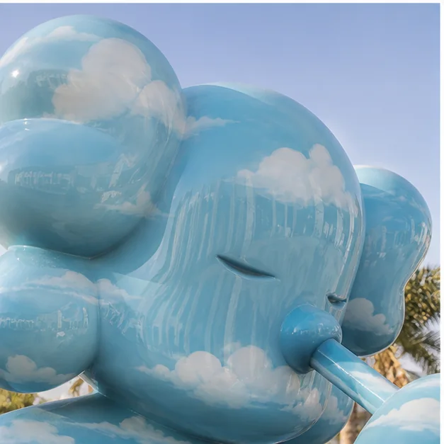 Close-up outdoor fiberglass sculpture under strong daylight