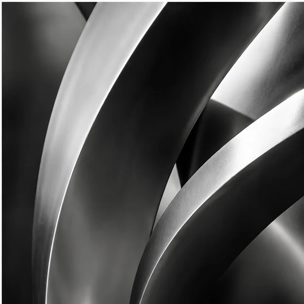 Monochrome stainless steel sculpture detail for final call to action